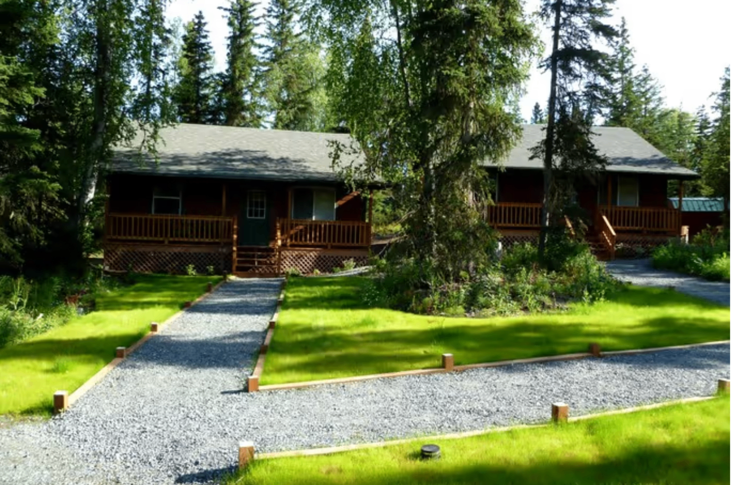Burly Bear Bunkhouse log cabin at dusk on the Kenai Peninsula